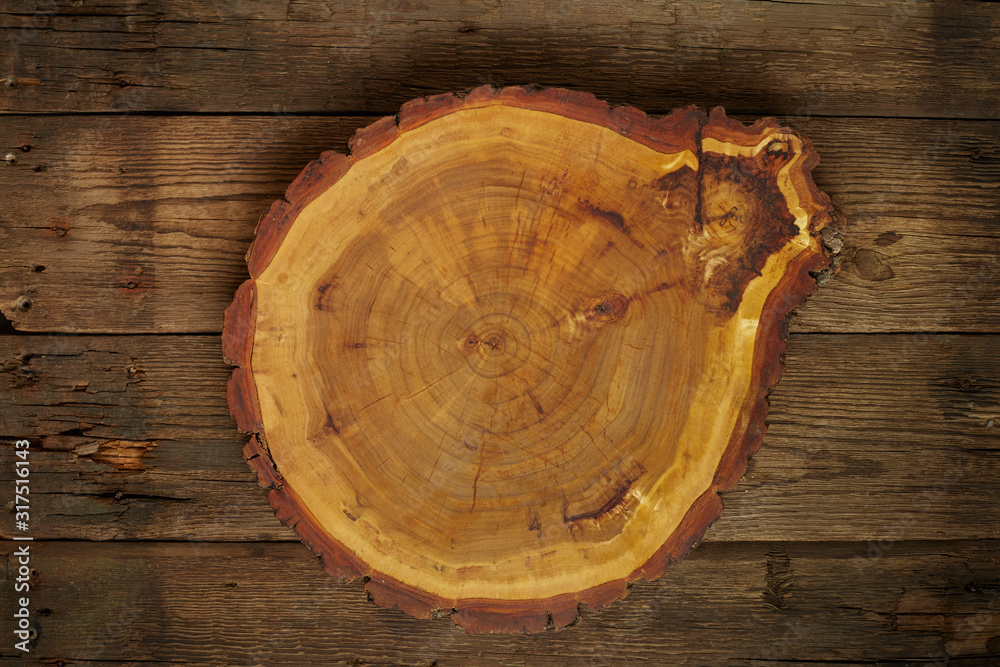 Top view wooden plate on wood background in vintage color tone / copy space Top view wooden plate on wood background in vintage color tone / copy space