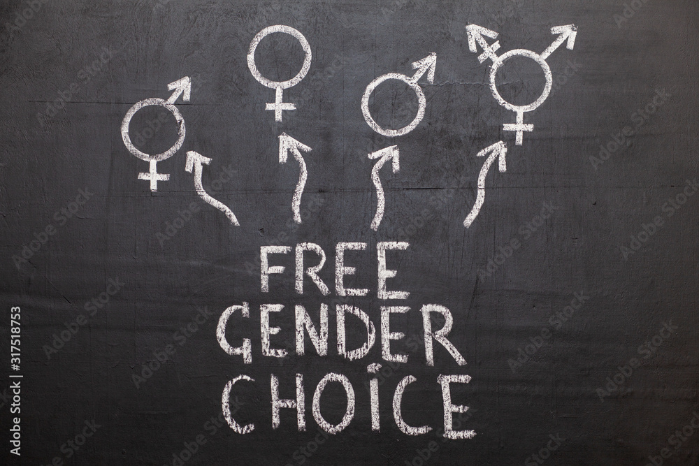 A symbol of transgender and female and male gender symbols on a chalkboard. The text on the Board A symbol of transgender and female and male gender symbols on a chalkboard. The text on the Board