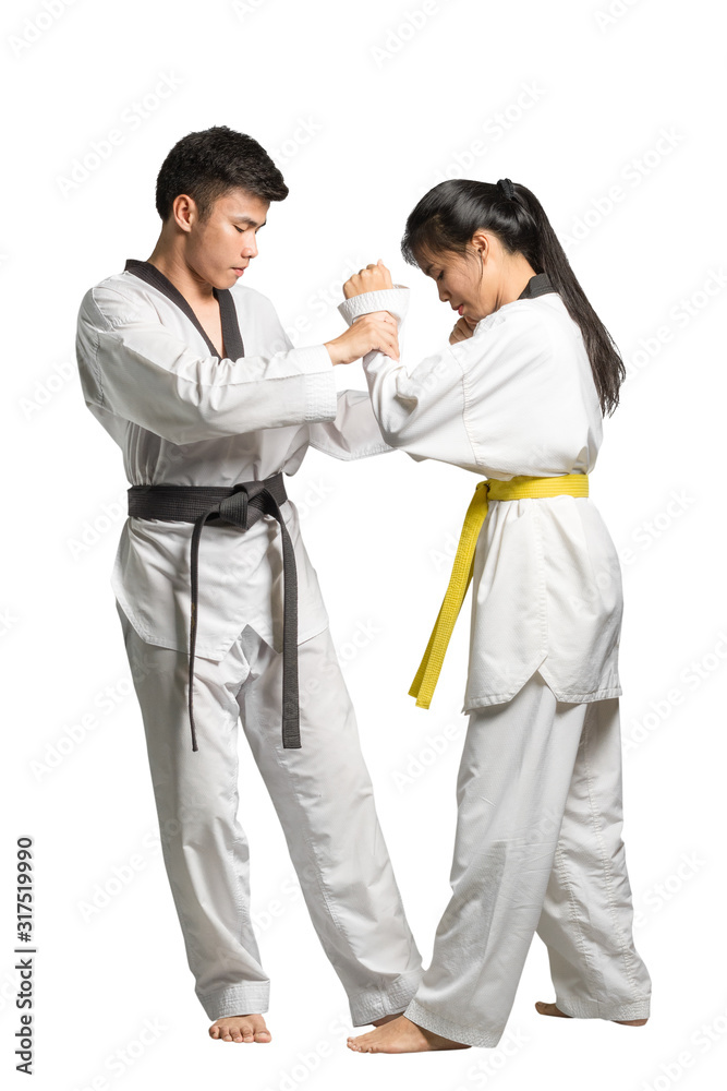 Portrait of an asian taekwondo trainer and a young beautiful asian woman. Isolated in white background
