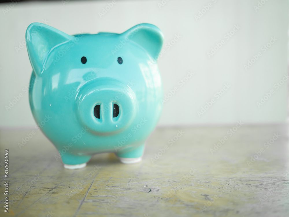 Fototapeta premium Blue piggy bank with white backgound. space for copy space