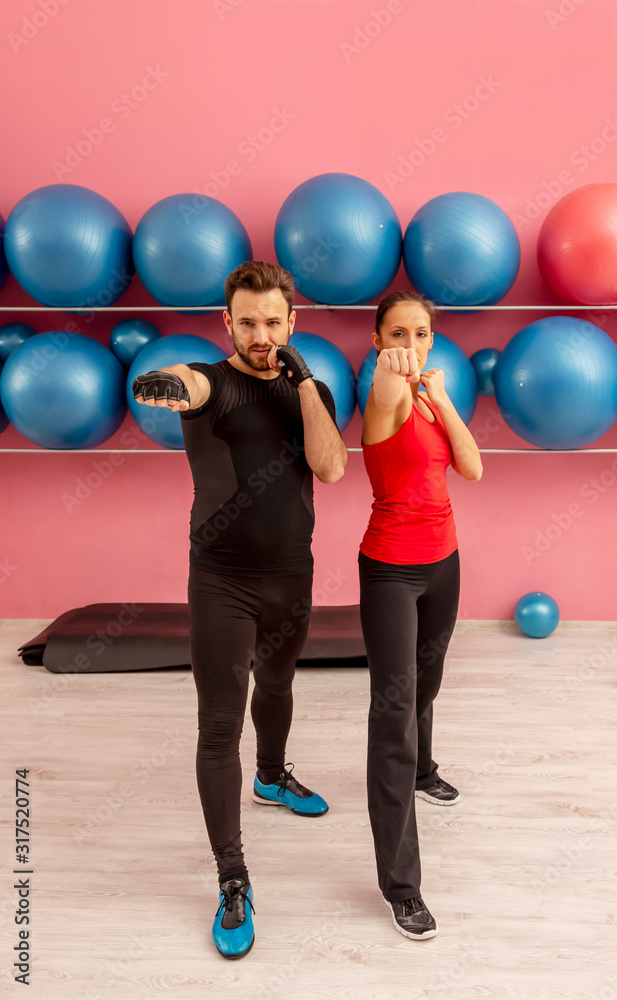 Naklejka premium Couple Training in a Gym