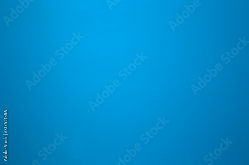 Aqua blue color on a solid stone wall as background texture. beautiful modern retro color photo