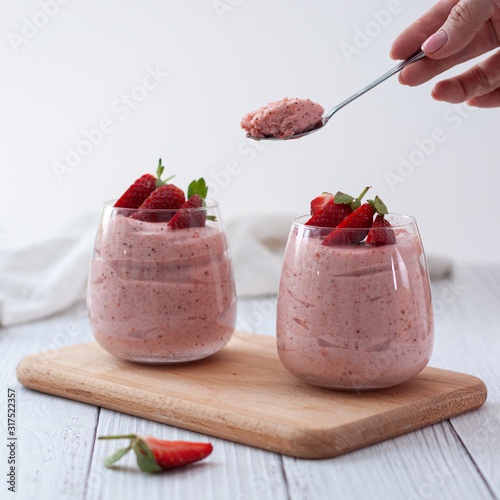 Strawberry mousse in clear glasses - healthy and fresh