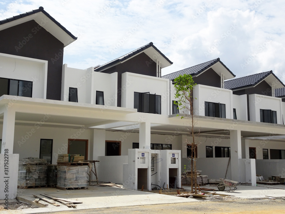 New double story luxury terrace house under construction in Malaysia.  Designed by an architect with a modern and contemporary style. 