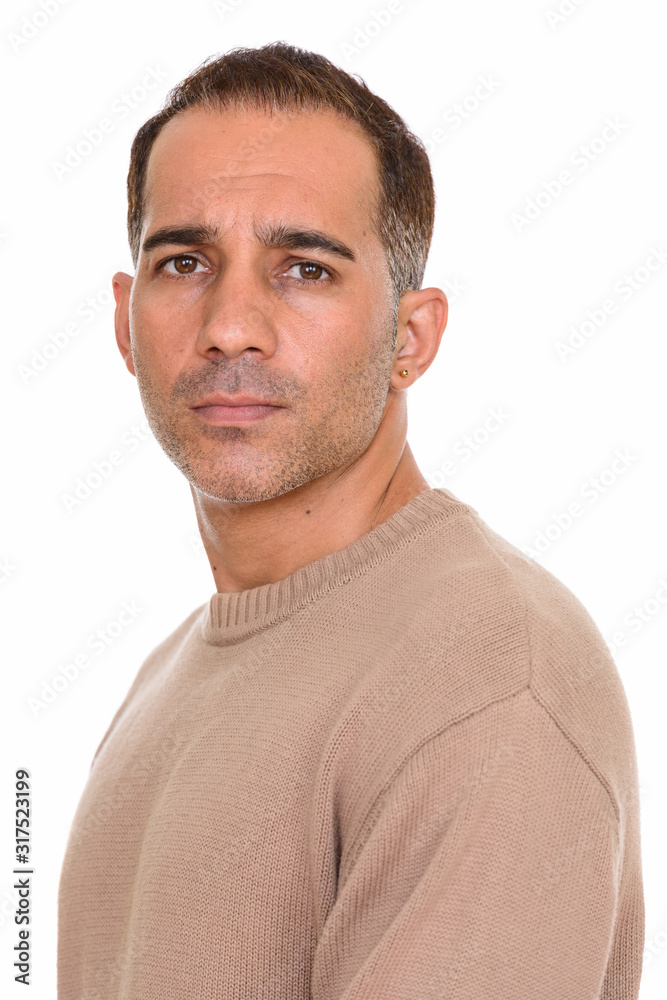 Face of mature handsome Persian man looking at camera Face of mature handsome Persian man looking at camera