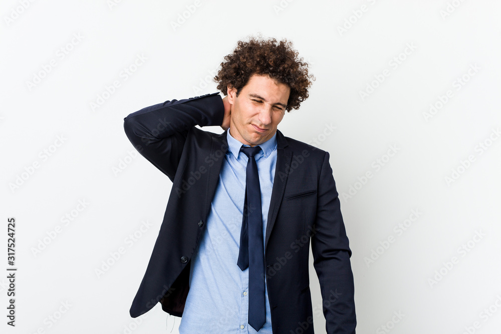 Young business curly man against white background suffering neck pain due to sedentary lifestyle. Young business curly man against white background suffering neck pain due to sedentary lifestyle.