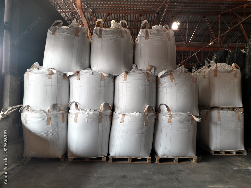 Chemical fertilizer Urea Stock pile jumbo-bag in warehouse waiting for shipment. Chemical fertilizer Urea Stock pile jumbo-bag in warehouse waiting for shipment.