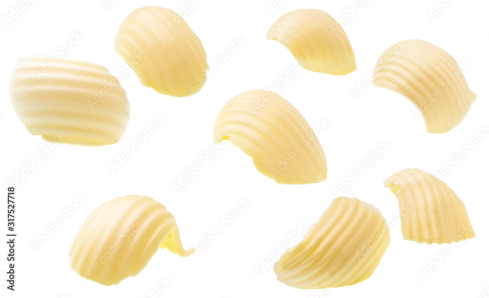 different butter curls or rolls isolated on white background. Clipping paths different butter curls or rolls isolated on white background. Clipping paths