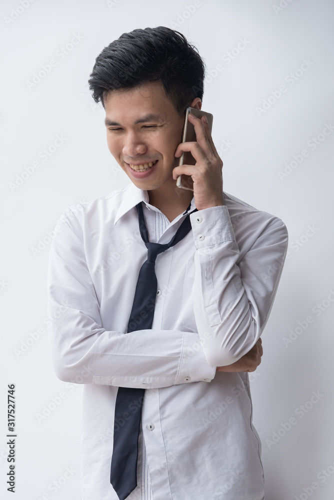 One asian business man hold hand phone,show feeling face smile,happy,agree, Man may have business success,life no problem. One asian business man hold hand phone,show feeling face smile,happy,agree, Man may have business success,life no problem.