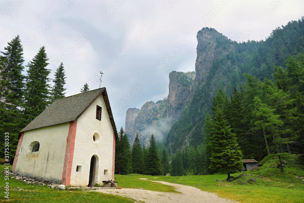 Scenic chapel and mountains in Puez-odle nature park in the dolomites, Italy