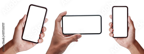 Hand holding the black smartphone iphone with blank screen and modern frameless design in two rotated perspective positions - isolated on white background  - Clipping Path  photo