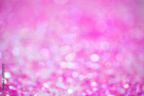 Pink-raspberry abstract background with bokeh. Festive background. Сoncept of magic, holiday, birthday. Holiday decoration. Template for design.
