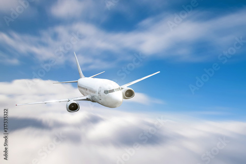 Jet passenger plane flying over cloudy sky in day time.