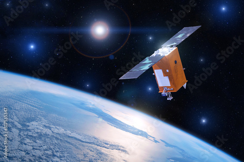 Fototapeta Naklejka Na Ścianę i Meble -  Satellite for studying the atmosphere and hydrosphere in the low orbit of planet Earth. Elements of this image furnished by NASA.