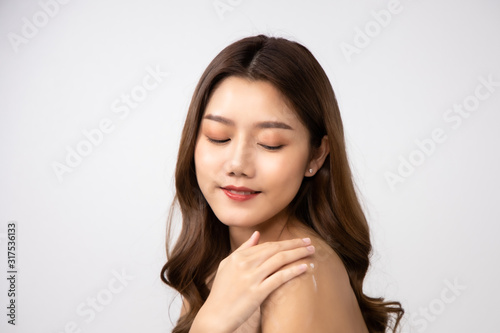 Beautiful Young Asian Woman short hair with Clean Fresh Skin. Face care, Facial treatment, Cosmetology, beauty and healthy skin and cosmetic ideas concept.pretty woman holding half of orange .