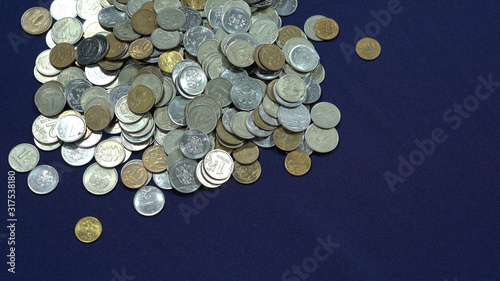Ruble coins. Pennies. A pile of coins on a blue background. A trifle  rubles