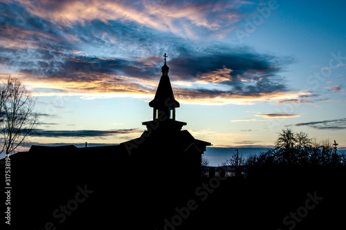 Orthodox wooden church at dawn. Temple of the Blessed Matrona of Moscow Soligorsk