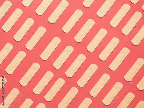 Band aid pattern on red background