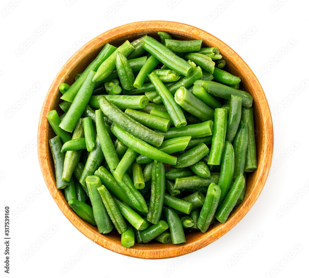 Slices of green beans in a plate on a white background, top view. Isolated Slices of green beans in a plate on a white background, top view. Isolated