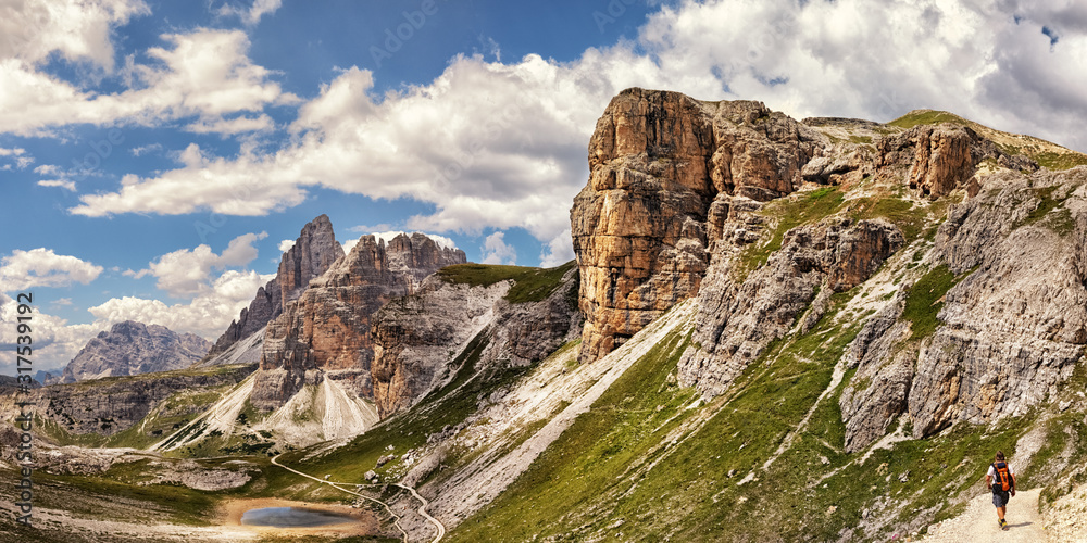 Hiking near Lago di Cengia in the Three Peaks nature park, Dolomite Alps in South Tyrol, Italy