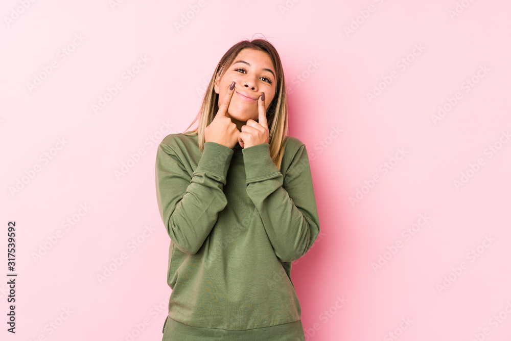 Young caucasian woman posing isolated doubting between two options. Young caucasian woman posing isolated doubting between two options.