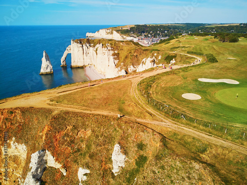 Picturesque panoramic landscape of white chalk cliffs and natural arches of Etretat, Normandy, France