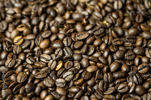 Roasted brown coffee beans. Background coffee texture. © SlavoArtist