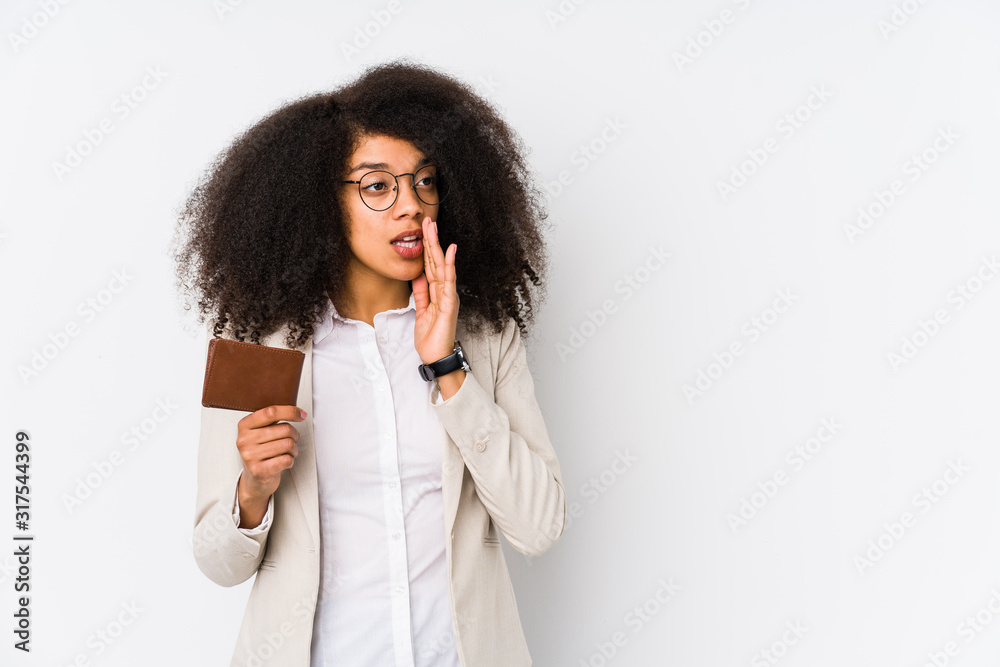 Young afro business woman holding a credit car isolated Young afro business woman holding a credit caris saying a secret hot braking news and looking aside Young afro business woman holding a credit car isolated Young afro business woman holding a credit caris saying a secret hot braking news and looking aside