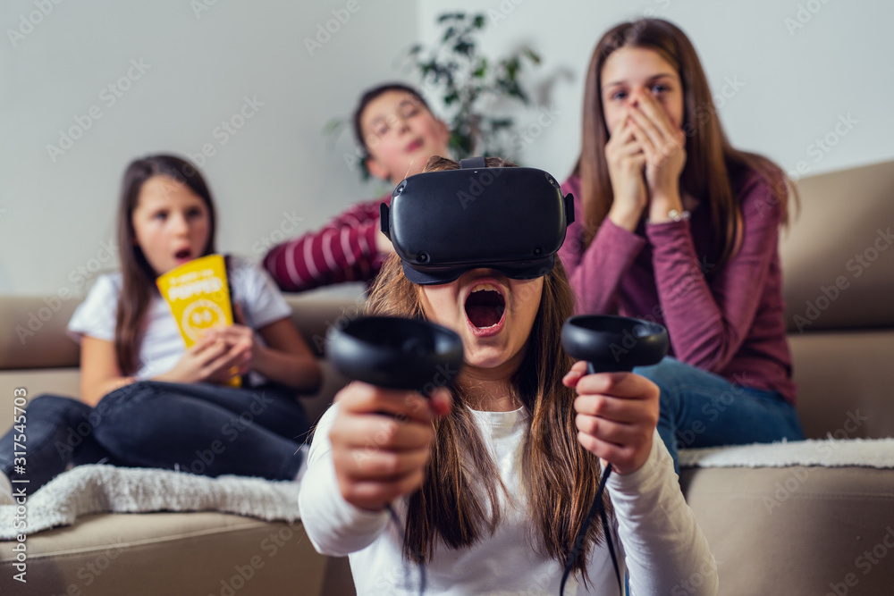 Teenagers playing video game at home. Teenagers playing video game at home.