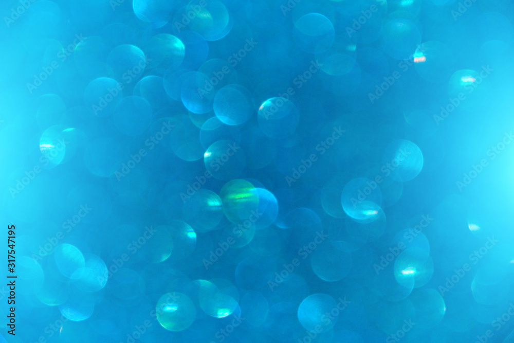 Abstract background with blurred bokeh in blue.