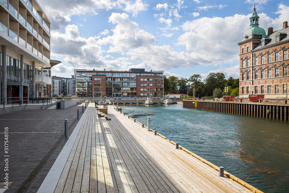 Landskrona Port, marina and surrounding mixed-use neighborhood with water tower in the back in Landskrona, Sweden