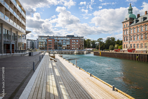 Obraz na płótnie Landskrona Port, marina and surrounding mixed-use neighborhood with water tower in the back in Landskrona, Sweden w salonie