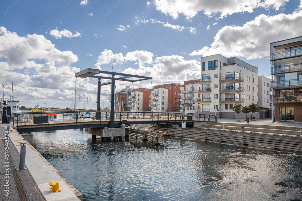 Landskrona Port, marina and surrounding mixed-use neighborhood with water tower in the back in Landskrona, Sweden
