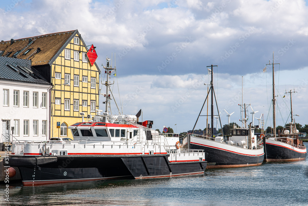 Landskrona Port, marina and surrounding mixed-use neighborhood with water tower in the back in Landskrona, Sweden