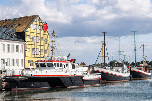 Obraz na płótnie Landskrona Port, marina and surrounding mixed-use neighborhood with water tower in the back in Landskrona, Sweden w salonie