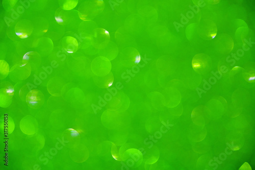 Abstract background with blurred bokeh in green.