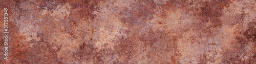 Rusty brown metal background.Steel oxidizing texture.Damaged old metal surface. © Milovan