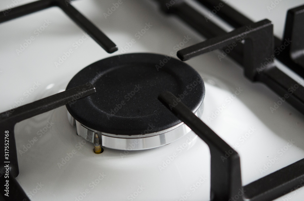 Switched off gas burner close-up. Kitchen appliances. Gasification, utilities. Switched off gas burner close-up. Kitchen appliances. Gasification, utilities.