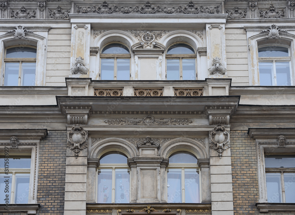 Facade details of old building on Porici street in Prague.