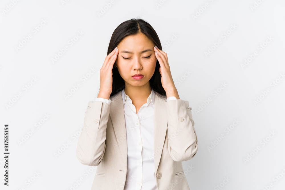 Young chinese business woman isolated touching temples and having headache. Young chinese business woman isolated touching temples and having headache.