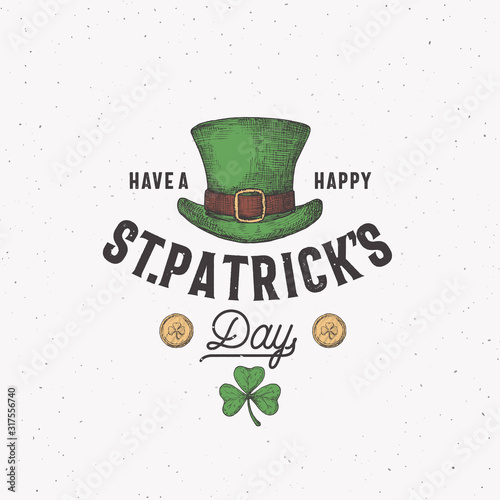 Vintage Style Saint Patricks Day Logo or Label Template. Hand Drawn Leprechauns Hat, Gold Coins and Shamrock Leaf Sketch Symbols with Retro Typography. Shabby Texture Background.