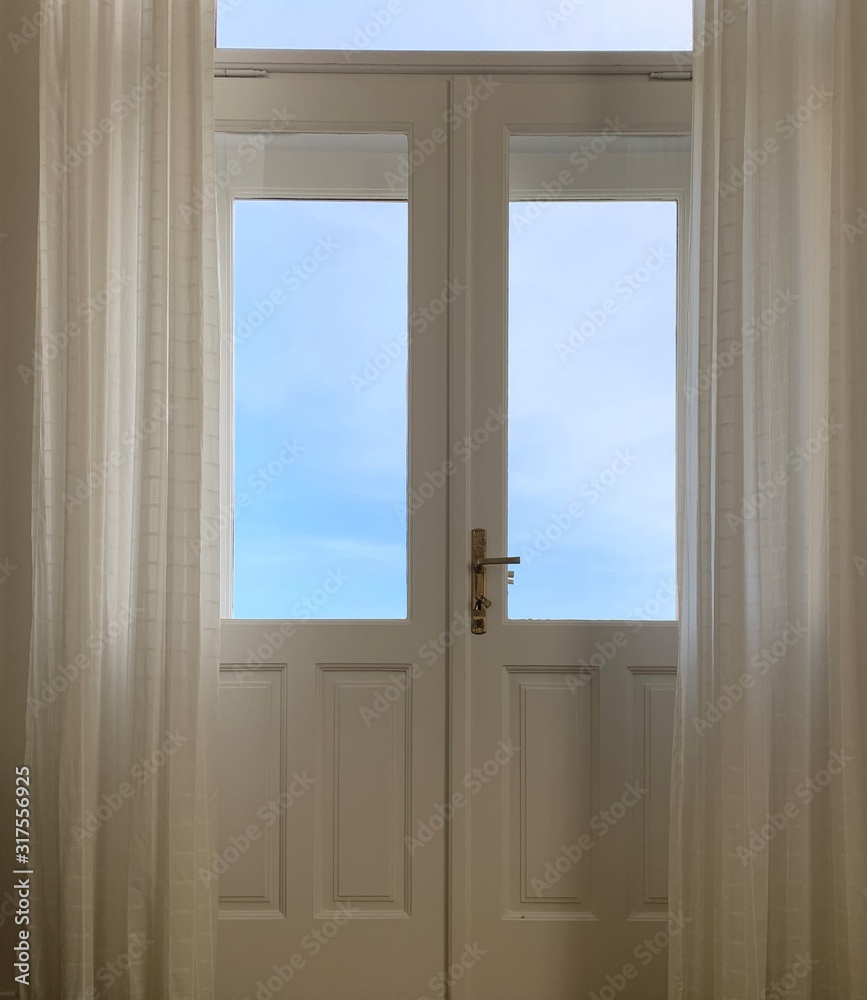 Fototapeta premium Sky view from the wooden windows with curtains