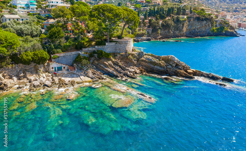 Rocky coast in Camogli, Italy. A bird-eye view on Adriatic seaside, Liguria.