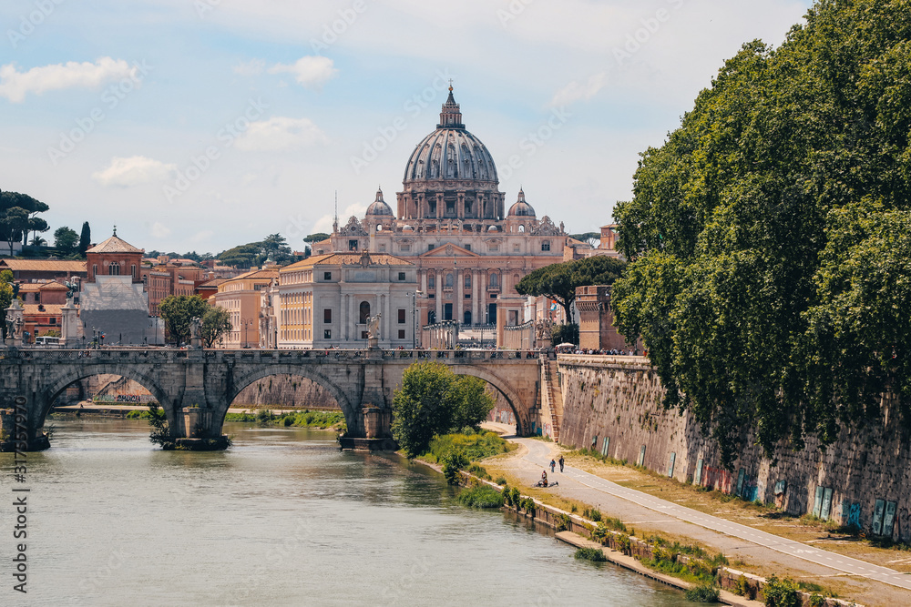St. Peter's Basilica, St. angel bridge over the Tiber river, view of the Vatican. Rome, Italy, May 2019.