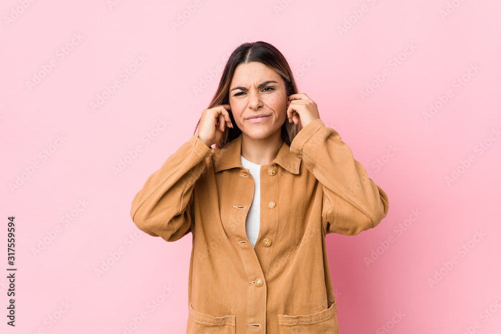 Young caucasian woman isolated covering ears with hands. Young caucasian woman isolated covering ears with hands.