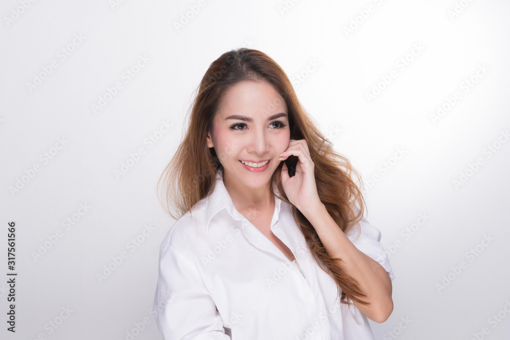 Asian woman portrait with perfect skin and wearing a white shirt in profile isolated on gray background. Asian woman portrait with perfect skin and wearing a white shirt in profile isolated on gray background.