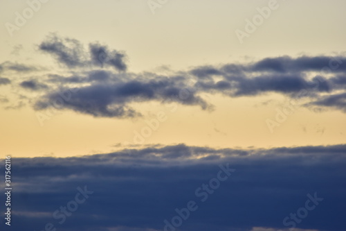 Fototapeta Naklejka Na Ścianę i Meble -  winter snow clouds at sunset