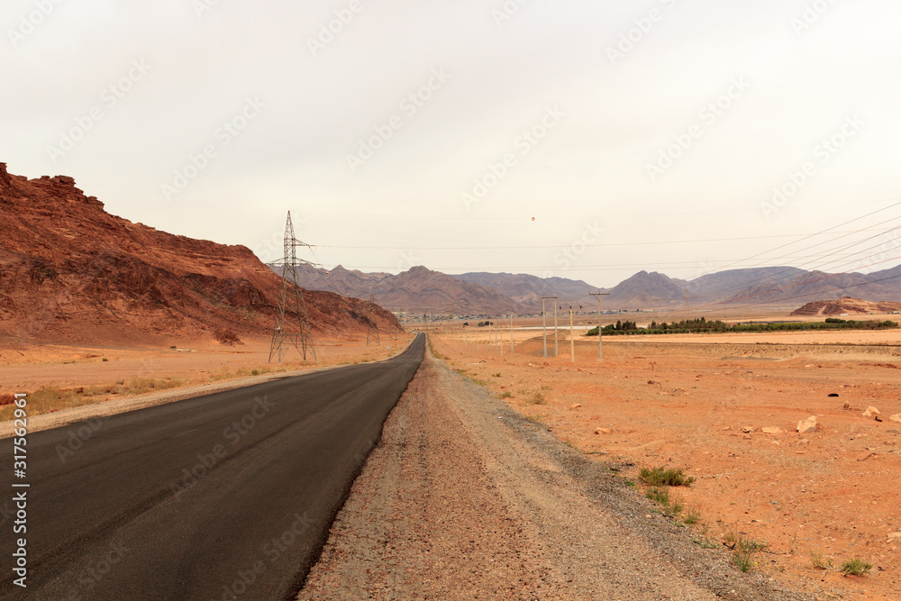 Street to desert Wadi Rum and mountain panorama, Jordan
