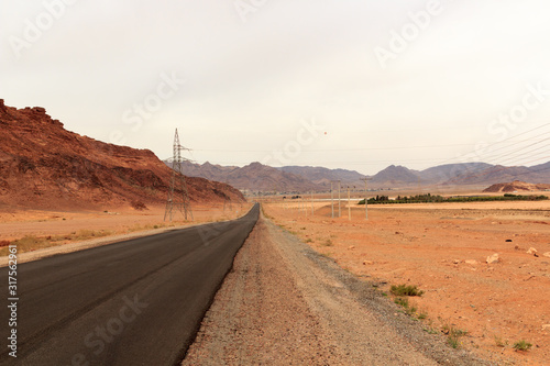 Street to desert Wadi Rum and mountain panorama  Jordan