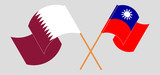 Crossed and waving flags of Taiwan and Qatar
